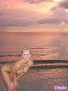 Holy fuck is this blonde hot pulling her thong out of the way and shows her snatch