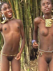 Dark skinned cutie gets nude for camera