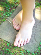Dirty bitch in a black bra and panties stuffing her feet into dude's mouth laying on the floor