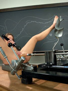 Busty beautiful bimbo passioantely fingering her pussy before taking machine dildi deep in it.