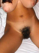 Autumn lays her beautiful, curvy body down and slips her little panties off to reveal her hairy, smooth pussy. then she caresses her lips to feel the