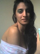 Indian lovely girl pulls up her white t-shirt and showing that she has nothing under it.