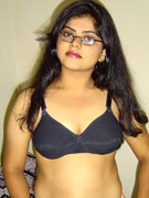 Ponytailed indian chick takes off her clothes and shows off her small tits