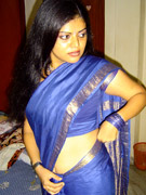 Sensual exotic dark featured girl looks like the princess of the island.