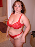 Busty amateur brunette chick in tight nylons touching and toying her pussy on a cam
