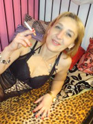 Mature blonde milf in black nylons and on high heels pleasing her wet pussy with thick dildo.
