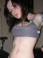 Delicious black teenie with a sweet delicate body posing naked on bed