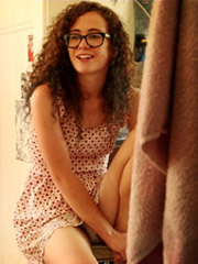 Ponytailed brunette teen with tattoos showing off her enormous natural jugs