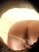 Unsuspecting wench shot from behind taking a wee