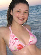 Amazing teen christine young flashing her tits on the beach