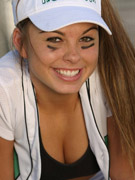 A teen girl playing softball at the high school