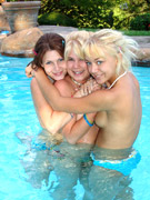 Friends wet and wild on the poolside