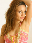 "carla in gorgeous pink spotty lingerie and white net stockings."