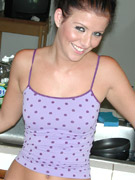 Taryn thomas on all fours on the kitchen floor