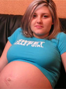 Pregnant candy spreads her legs to show off her pierced pussy