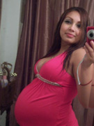 Hot preggy brunette getting wet in the bathtub