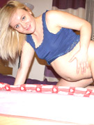 Two preggo cuties slip out their panties and oiling each other bodies before pussy toying.