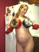 Horny pregnant teen shows off her swollen breasts and pierced pussy