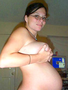 Two preggo cuties slip out their panties and oiling each other bodies before pussy toying.