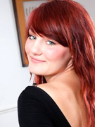 Charming redhead with smooth pale skin and supple assets.