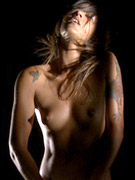 Very hairy dread locked hippie girl out in nature strips and shows her hairy body.