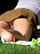 Sexy blondie empties her bladder behind a building